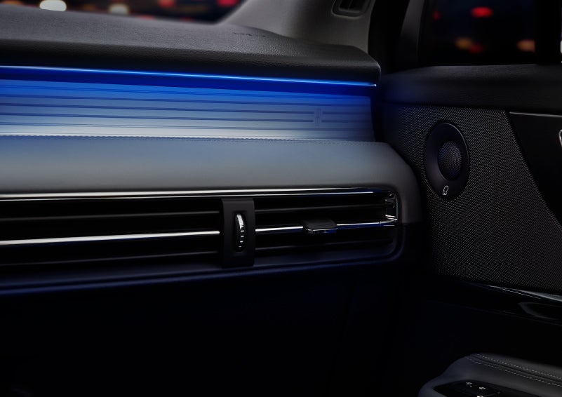 A thin available ambient blue lighting illuminates the pinstripe aluminum under an ebony dashboard, emitting a cool energy | Randy Marion Lincoln in Statesville NC