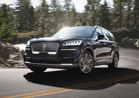 A Lincoln Aviator® SUV is being driven on a winding mountain road | Randy Marion Lincoln in Statesville NC