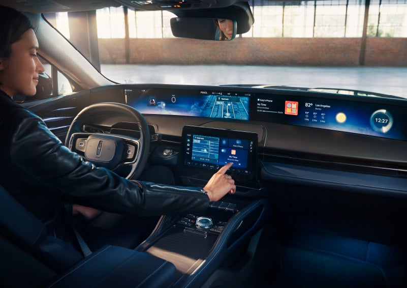 The driver of a 2024 Lincoln Nautilus® SUV interacts with the center touchscreen. | Randy Marion Lincoln in Statesville NC