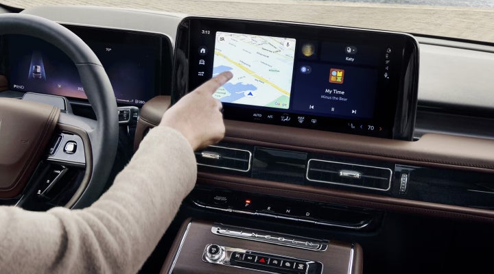 A person is tapping the center display touchscreen of a 2026 Lincoln Aviator® SUV. | Randy Marion Lincoln in Statesville NC