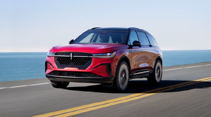 A 2026 Lincoln Nautilus® SUV is being driven on a seaside roadway. | Randy Marion Lincoln in Statesville NC