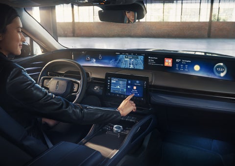 The driver of a 2026 Lincoln Nautilus® SUV interacts with the center touchscreen. | Randy Marion Lincoln in Statesville NC
