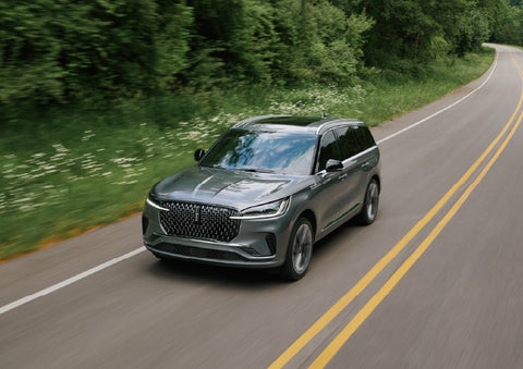 A 2027 Lincoln Aviator® SUV is being driven down a road. | Randy Marion Lincoln in Statesville NC