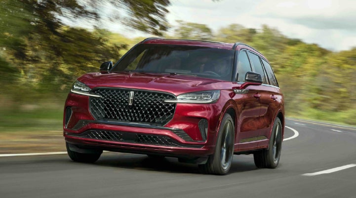 A 2027 Lincoln Aviator® SUV is being driven on a country road | Randy Marion Lincoln in Statesville NC