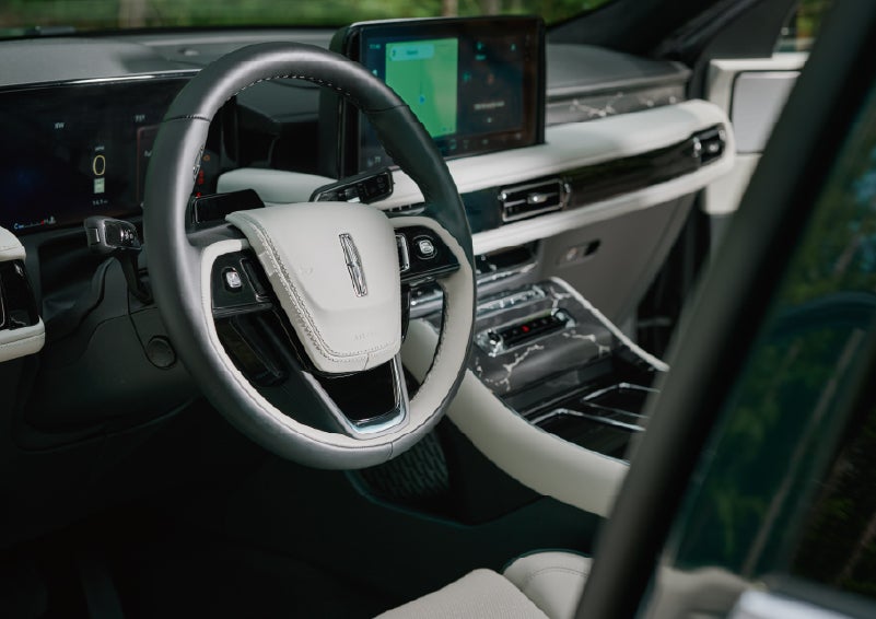 The leather-trimmed steering wheel of a 2027 Lincoln Aviator® Black Label™ SUV. | Randy Marion Lincoln in Statesville NC