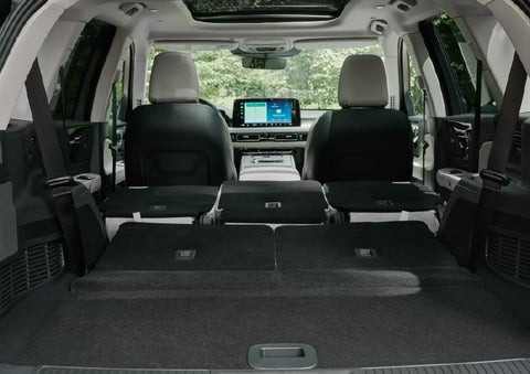 A rear to front view of the interior of a 2027 Lincoln Aviator® Black Label™ SUV shows the third and second rows folded flat | Randy Marion Lincoln in Statesville NC