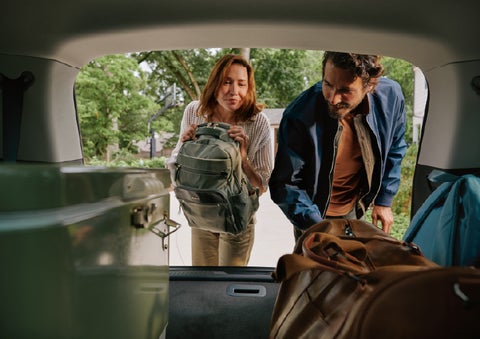 A couple loads luggage into the rear of a 2027 Lincoln Aviator® Black Label™ SUV..e 202 | Randy Marion Lincoln in Statesville NC